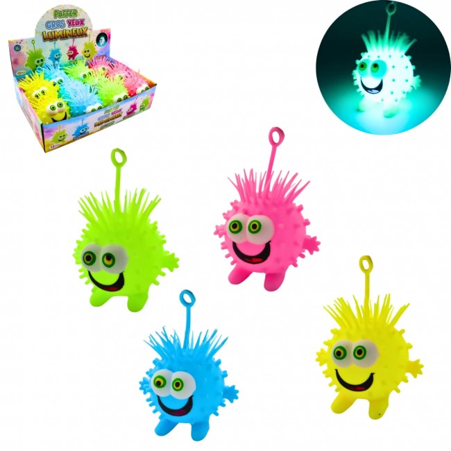 Pelota antiestrés luminosa con ojos grandes y púas en varios colores.