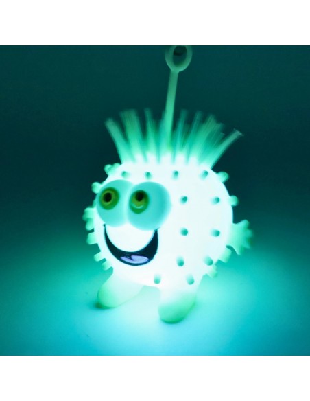 Pelota Puffer Ball brillando en la oscuridad con luz LED azul