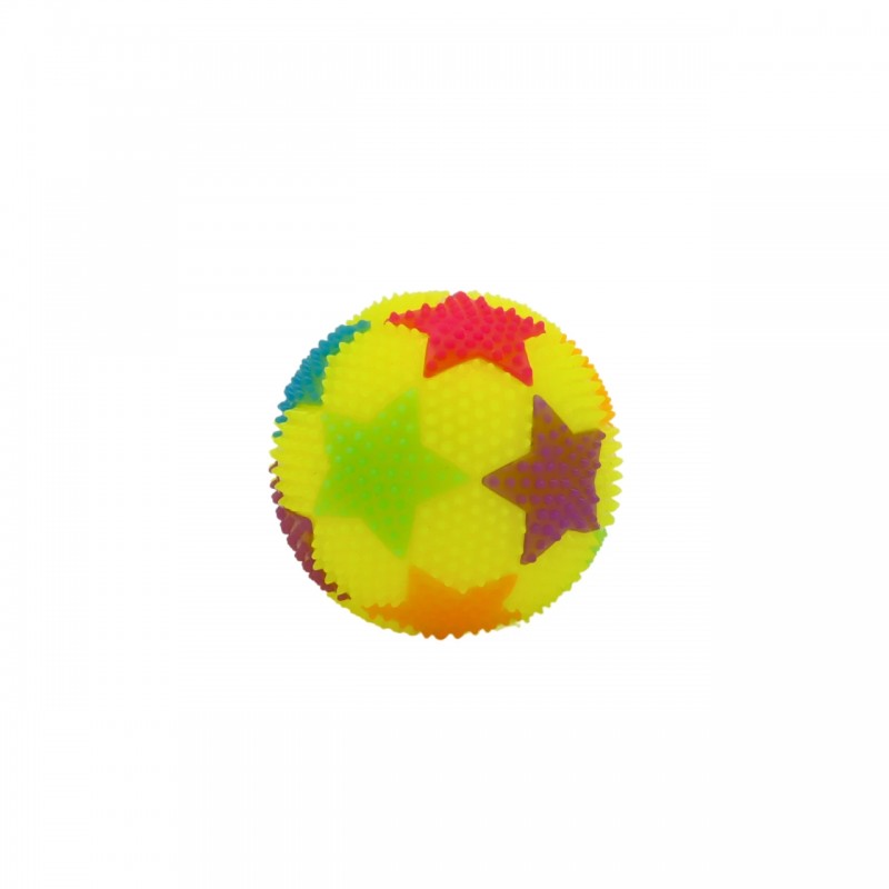Detalle de destello LED en pelota saltarina amarilla.