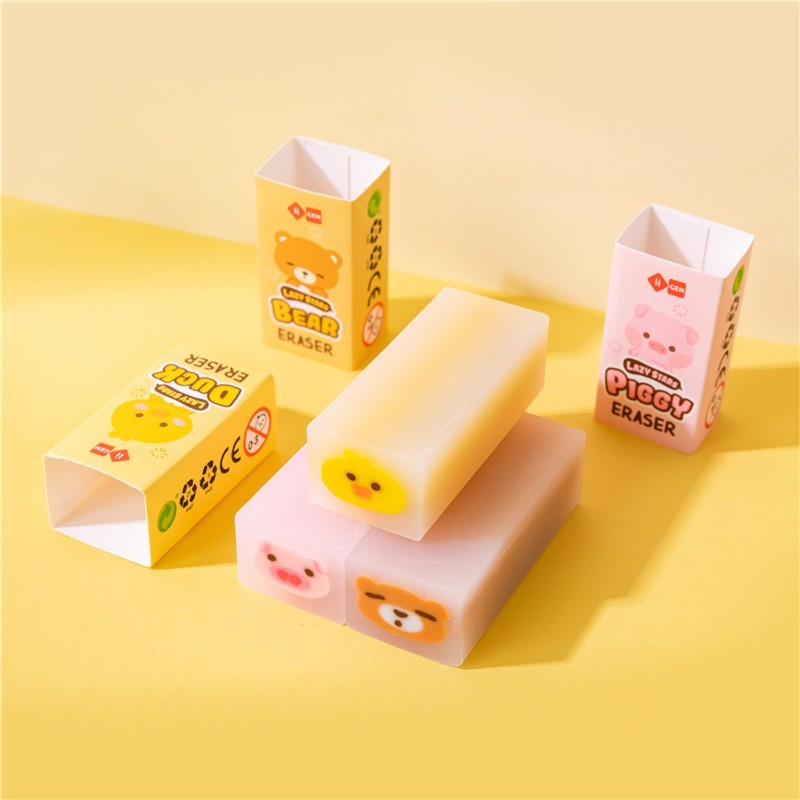 Gomas de borrar kawaii con forma de patito amarillo, cerdito rosa y osito azul.