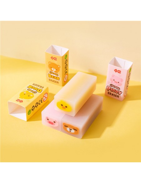 Gomas de borrar kawaii con forma de patito amarillo, cerdito rosa y osito azul.