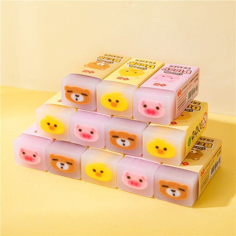 Gomas de borrar kawaii con forma de patito amarillo, cerdito rosa y osito azul.
