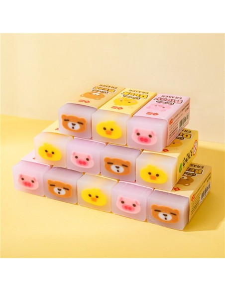 Gomas de borrar kawaii con forma de patito amarillo, cerdito rosa y osito azul.