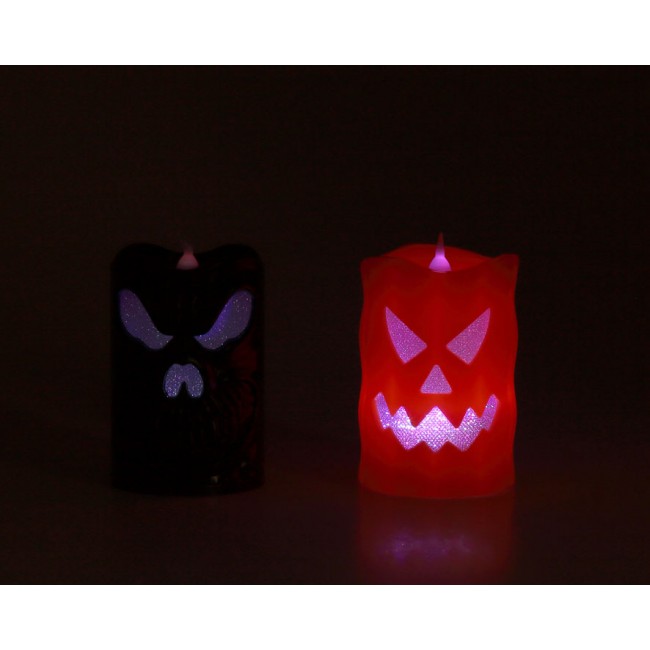 Vela LED de Halloween de 10 cm. con diseño de calavera en colores naranja y negro y luz superior. 2