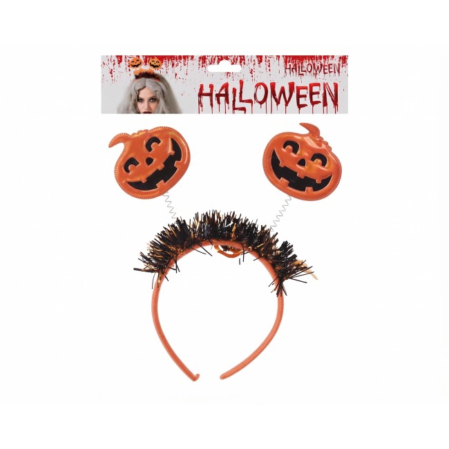 Modelo luciendo una diadema de Halloween con calabazas en muelles y flecos decorativos. 2