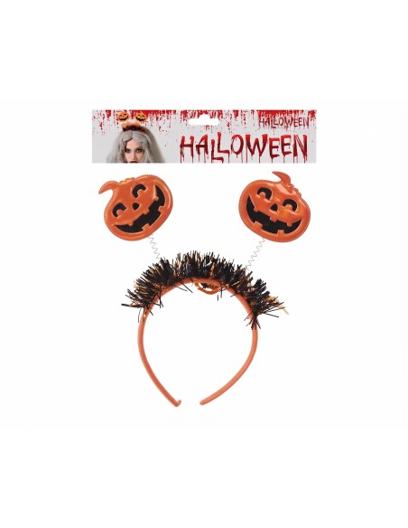 Diadema de Halloween con calabazas y muelles presentada en su empaque original.